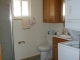 The bath off of the Arizona room features large cabinet space and a linen closet along with washer and drier. Master bath also has large cabinets.